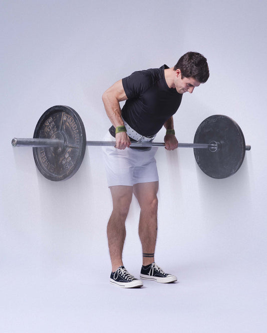 man doing barbell rows