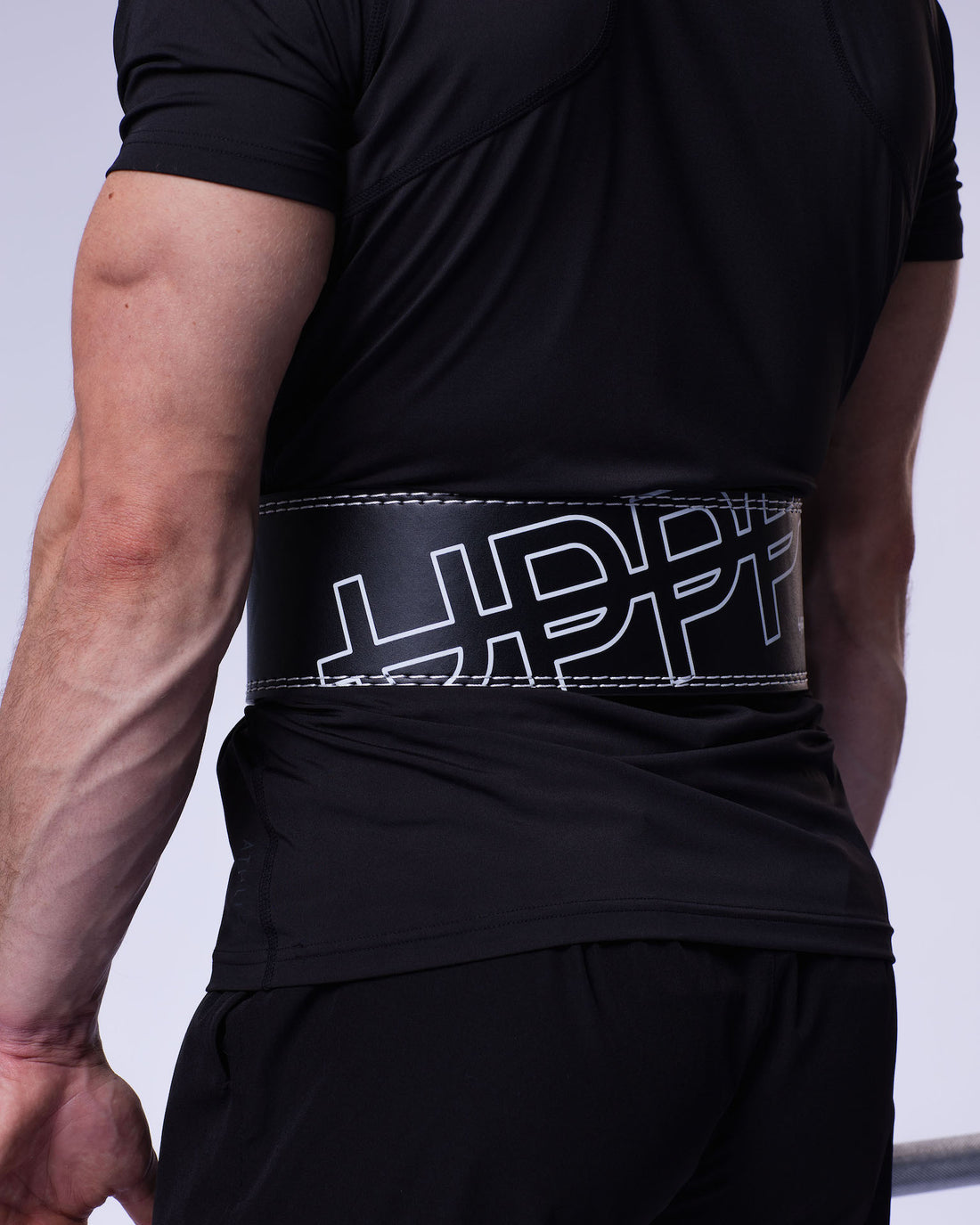 man wearing uppper 10mm black lever belt