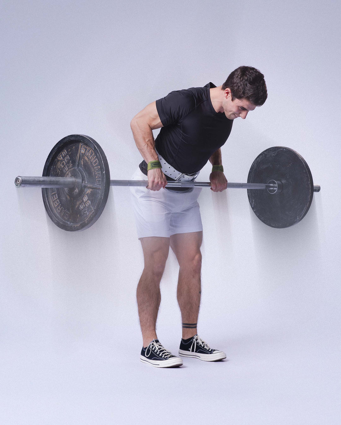 man doing barbell rows