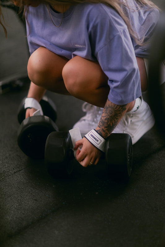 woman using uppper lifting straps white