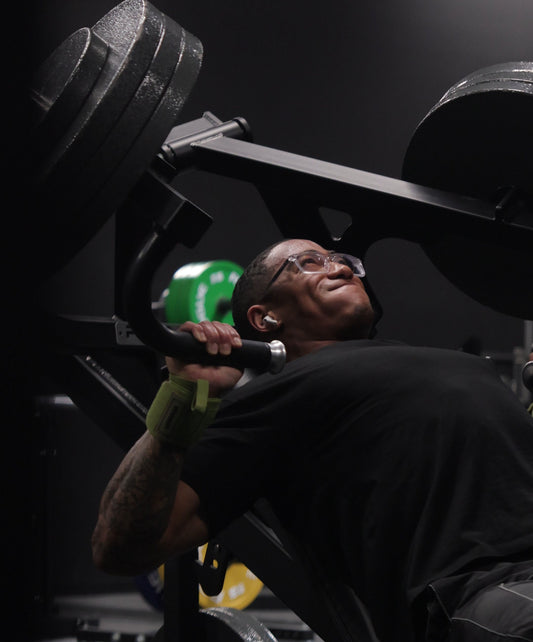 man training hard wearing uppper wrist wraps