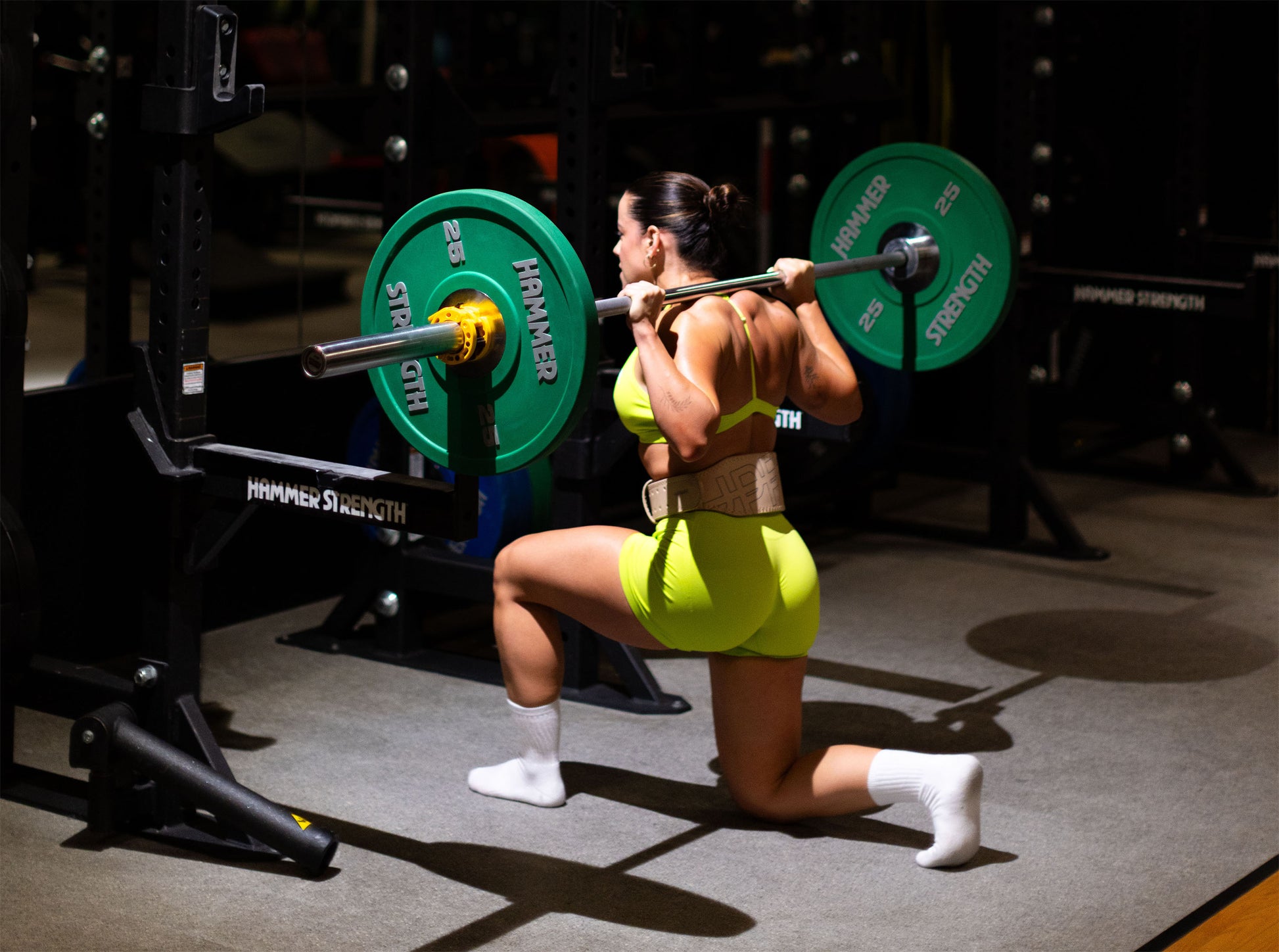 athlete performing exercise in sail uppper lifting belt shot in gym 